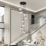 Long spiral staircase chandelier perfectly scaled for modern grand staircases and foyers.