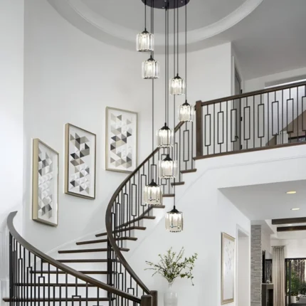 Contemporary spiral staircase pendant light enhancing a luxury curved staircase design.
