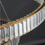 Detail of the polished gold finish frame and precision crystal placement on a Modern Gold Crystal Chandelier.