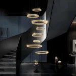8-Tier Modern Gold Crystal Chandelier hanging in a grand staircase foyer with high ceilings.