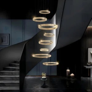 8-Tier Modern Gold Crystal Chandelier hanging in a grand staircase foyer with high ceilings.