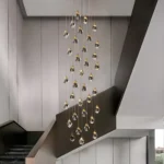 Large foyer chandelier creating a crystal waterfall effect