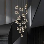 Breathtaking 2 story chandelier displayed above a minimalist TV lounge