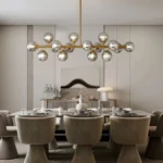 Contemporary linear chandelier featuring 16 smoky grey glass globes in a modern dining room setting.