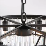 Sturdy Black Metal Frame and Chain Detail of a Tiered Crystal Lamp