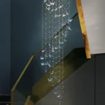 Stunning blue butterfly crystal ceiling light providing dramatic ambiance to a luxury space.
