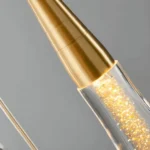 High-quality brushed brass finish detail on the LED teardrop light fixture connection point.