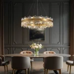 Symmetrical view of a contemporary gold brass crystal chandelier in a luxury interior.