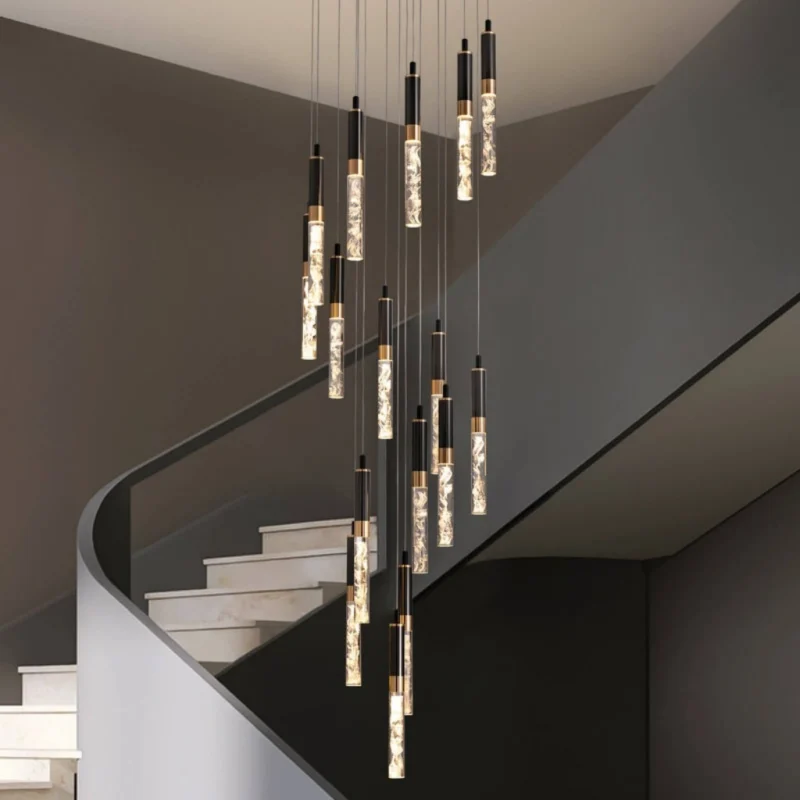 Large Foyer Chandelier Cascading Over a Modern Staircase