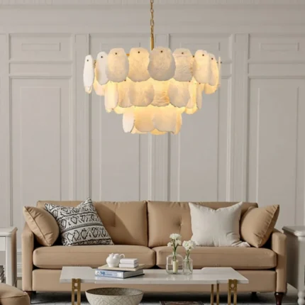 Luxury layered alabaster chandelier installed in a neutral toned high-end living room