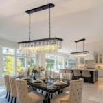 Double Installation View of Linear Crystal Chandeliers in Large Rooms