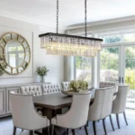 Luxury Linear Crystal Chandelier Hanging Over a Modern Dining Table