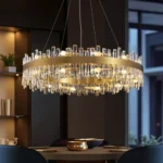 Luxury K9 crystal drum pendant light in a contemporary dark-themed dining room.