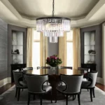 Modern Black Chandelier Centered Over a Contemporary Round Dining Table