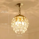 Detailed product shot of pine cone crystal chandelier showing width and adjustable height dimensions.