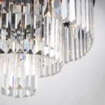 Sparkling Light Refraction from a Tiered Black Crystal Chandelier