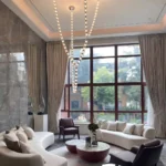 Large beaded crystal chandelier with warm led glow for high ceiling living room
