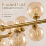 Brushed gold arm and champagne glass globe close-up