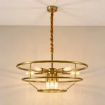 Gold finish chandelier frame with exposed bulbs and warm lighting