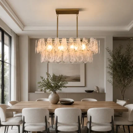 Gold glass chandelier with handcrafted cloud glass shades in a modern dining room