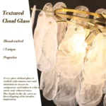 Hand-blown textured cloud glass detail on modern gold linear chandelier