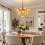 Amber glass bubble chandelier above a dining table