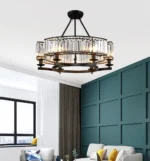 Black crystal chandelier with round frame and clear crystals in a modern living room