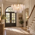 Coastal chandelier with cloud glass in a bright entryway