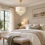 Crystal drum chandelier with white shell shade and crystal drops in a neutral bedroom