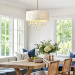 Drum shade chandelier with white shell shade and crystal drops in a bright breakfast nook