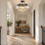 Entryway crystal chandelier with black frame in a modern hallway