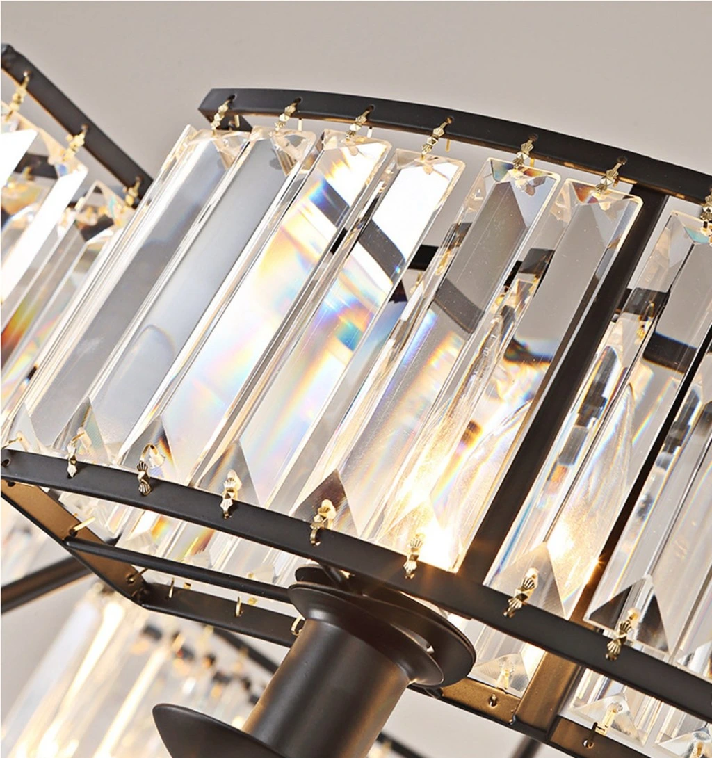 Close-up of clear K9 crystal prisms and black metal frame on a farmhouse crystal chandelier
