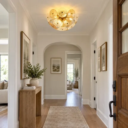 Glass disc chandelier with textured glass discs installed in a modern hallway
