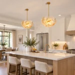 Glass disc chandeliers installed above a large kitchen island