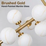 Glass globe chandelier with brushed gold frame and hand-painted marble-effect glass shades