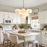 Glass globe chandelier with milk white shades over a kitchen island