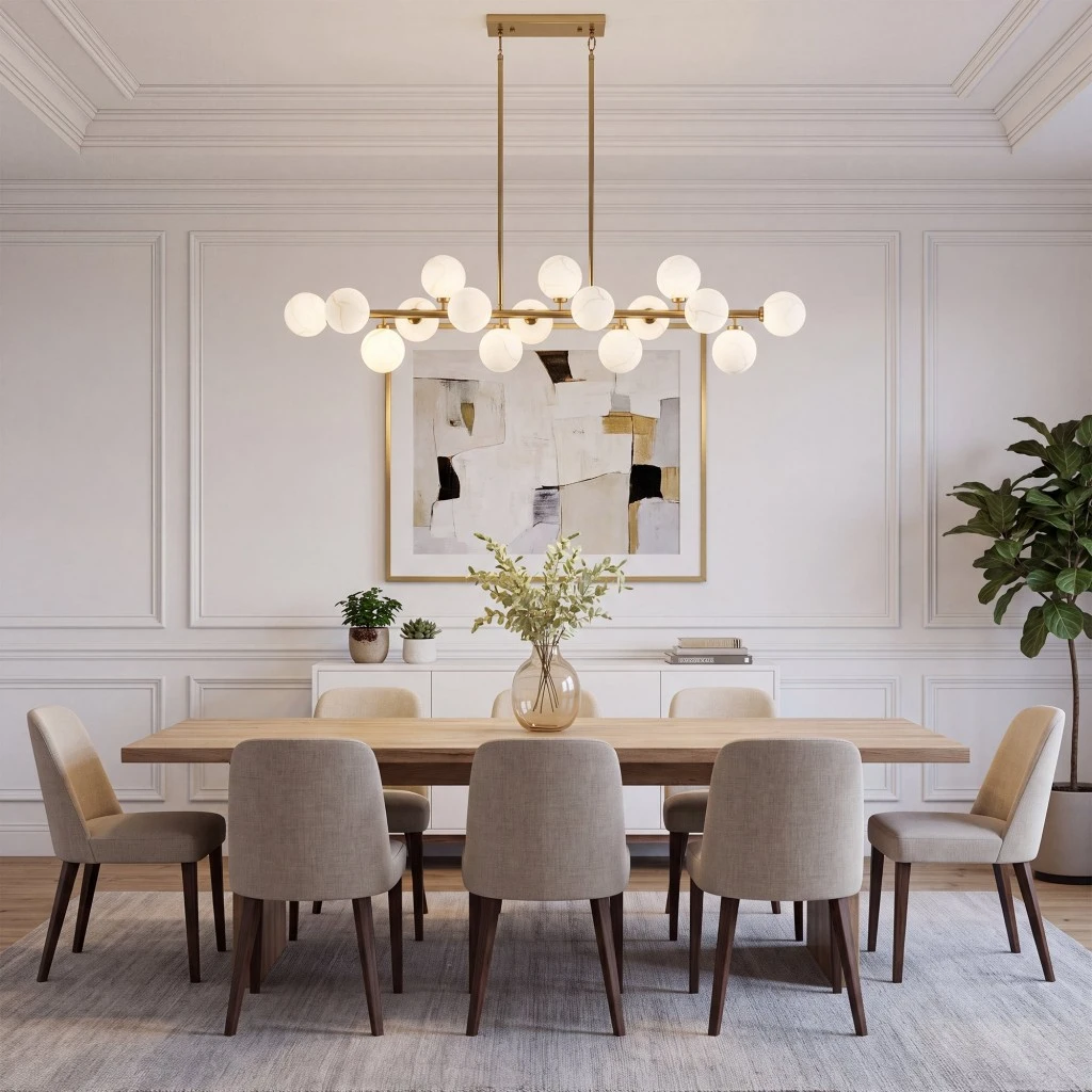 Gold globe chandelier with white glass shades above a modern dining table