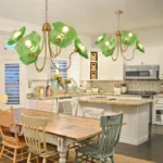 Green floral chandelier in a kitchen and dining space