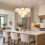 Milk glass bubble chandelier above a modern kitchen island