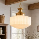 Milk glass pendant light with ribbed white glass shade and gold metal frame