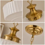 Milk glass pendant light details showing ribbed glass shade gold metal and ceiling canopy