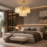 Modern cloud chandelier with warm lighting above a bedroom bed