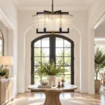 Modern farmhouse chandelier with water ripple glass in a bright entryway