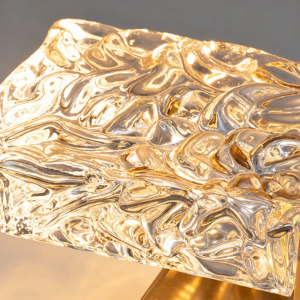Close-up of the illuminated textured crystal shade and its rippled light-reflecting pattern