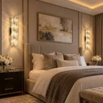 Pair of illuminated crystal wall sconces installed on both sides of a bed in a luxury bedroom