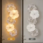 Five-flower wall light with textured clear and milky glass petals shown on and off