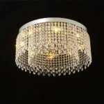 Close view of round crystal flush mount chandelier with warm lighting