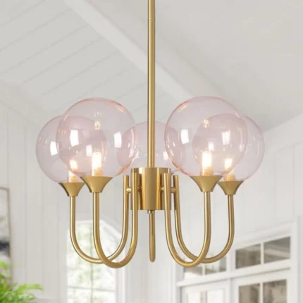 5-light glass bubble chandelier with pink glass globes and a gold metal frame