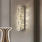 Chrome finish rectangular crystal wall light mounted on a decorative interior wall